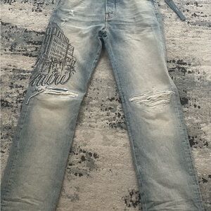 AMIRI Light Blue Distressed Jeans with Graphic
